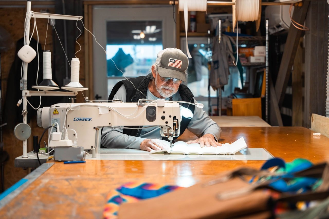 David Peed at his sewing machine in the CustomCanvas workshop, Surf City NC